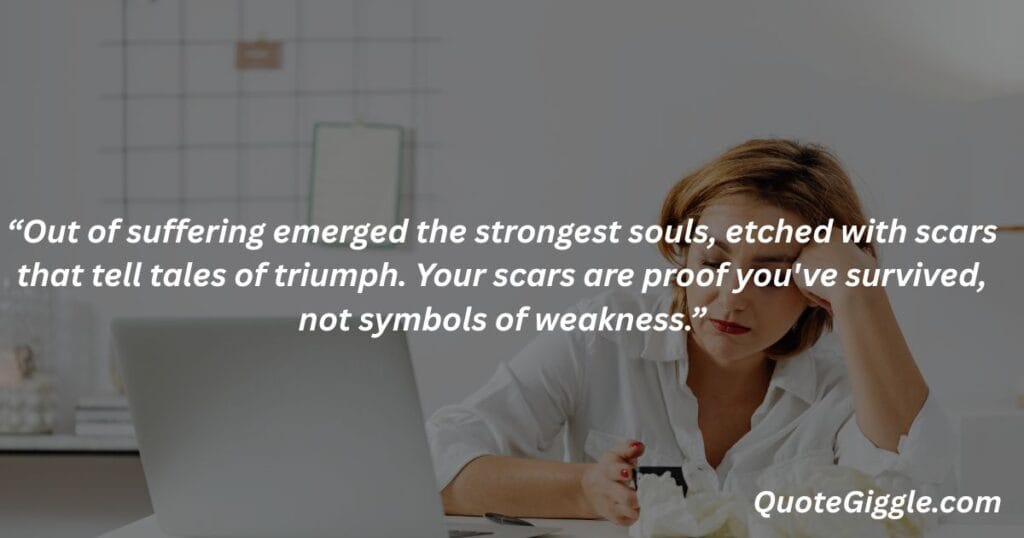 Motivational inspiring quotes for When You Feel Like Life is a Struggle 8 Stressed woman with head in hands symbolizing emotional pain, with the quote “Out of suffering emerged the strongest souls...” by QuoteGiggle.com — ideal for motivational inspiring quotes for when you feel like life is a struggle.