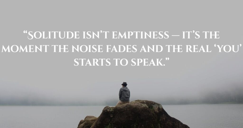Inspiring Loneliness Quotes To Help You Feel Less Alone 3 A man sitting alone on a mountain in a peaceful atmosphere, reflecting deeply with a solitude quote overlay.