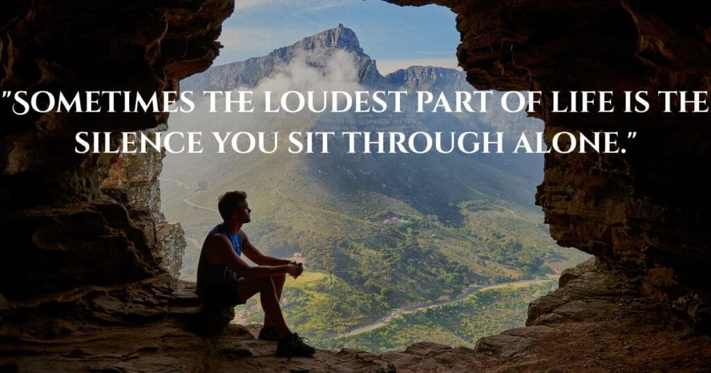 Inspiring Loneliness Quotes To Help You Feel Less Alone 4 A lonely boy sitting quietly inside a cave-like shelter, looking out at beautiful distant mountains in silence.