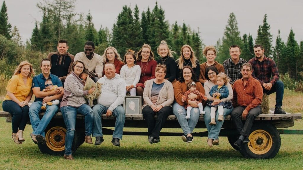 Motivational & Inspirational letter to my future self 2 A full large family from newborn to elderly sitting together, symbolizing love, support, family roots, and emotional connection for a motivational and inspirational letter to my future self.